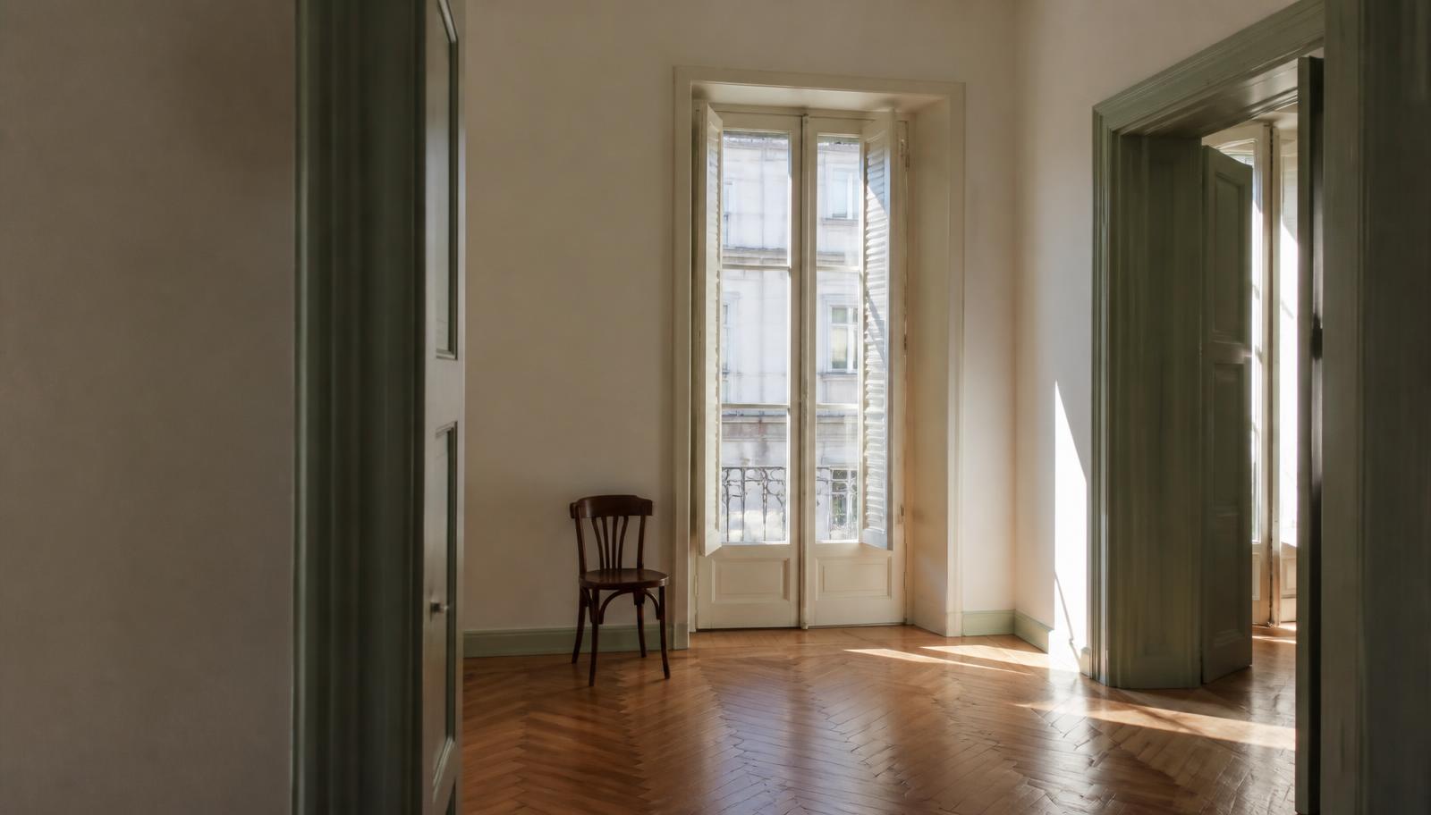 Quiet empty Lisbon apartment with tall shuttered windows